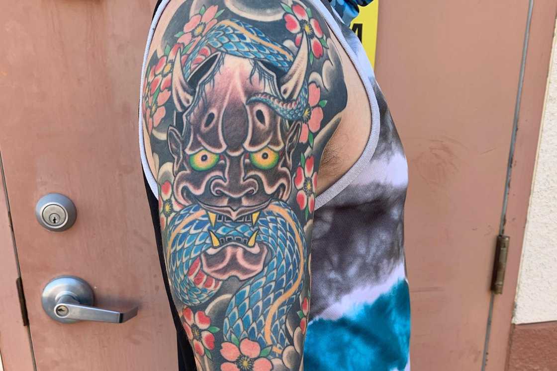 A full sleeve featuring an irezumi tattoo A full sleeve featuring an irezumi tattoo
