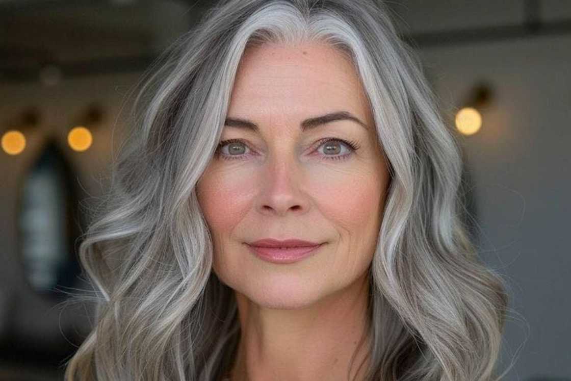 A side parted gray balayage lob with textured layers A side parted gray balayage lob with textured layers