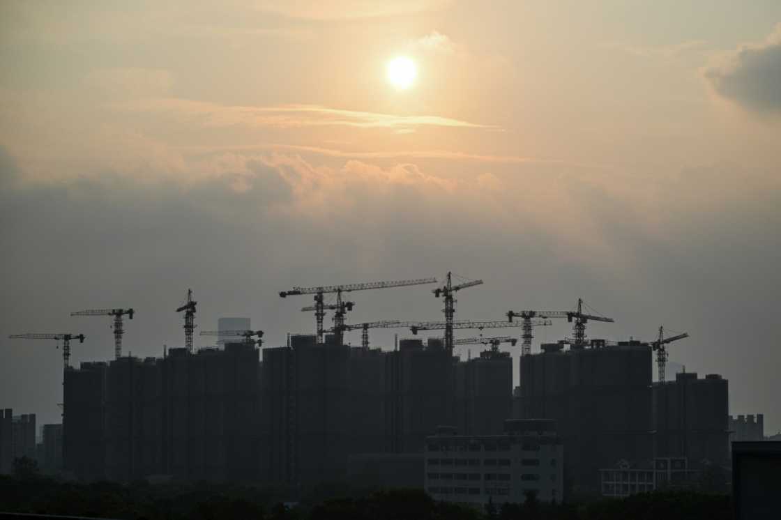 Buildings under construction are seen during sunset in Shanghai on September 6, 2024. Buildings under construction are seen during sunset in Shanghai on September 6, 2024.