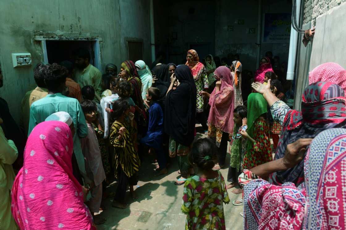 People queue to receive medical attention at a medical camp on the outskirts of Sukkur People queue to receive medical attention at a medical camp on the outskirts of Sukkur