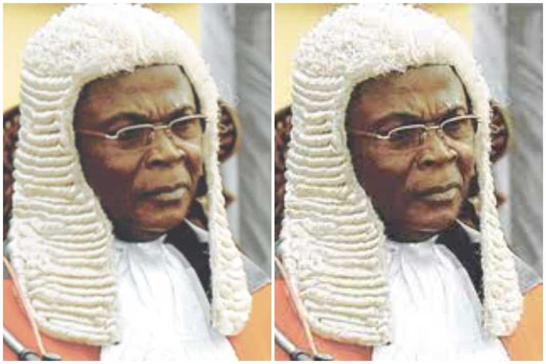 George Kingsley Acquah is wearing a white wig and bib George Kingsley Acquah is wearing a white wig and bib
