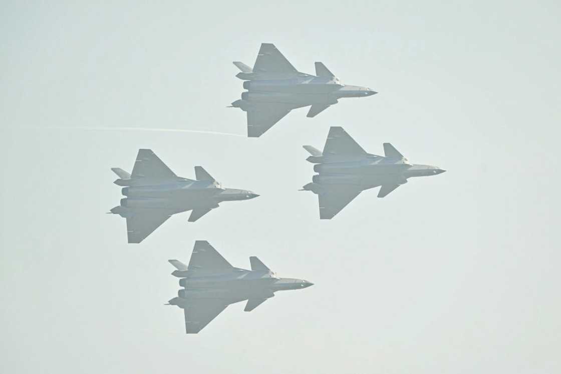 Chinese-made Chengdu J-20 stealth fighters fly in formation at Airshow China Chinese-made Chengdu J-20 stealth fighters fly in formation at Airshow China