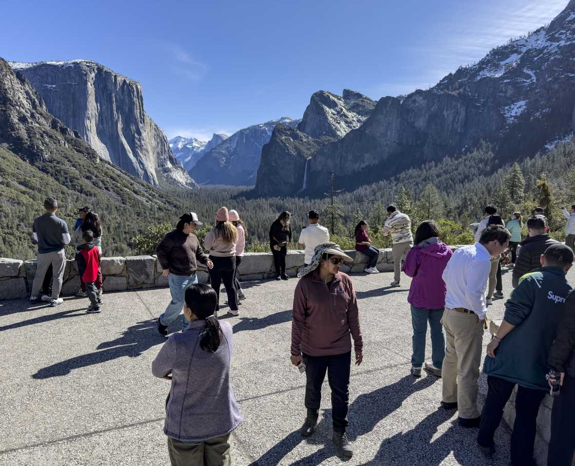 People gather at Tunnel View to take pictures of The Valley in Yosemite National Park, California. People gather at Tunnel View to take pictures of The Valley in Yosemite National Park, California.