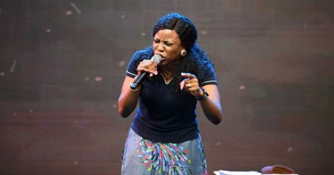 Pastor Eno Jerry praying on stage Pastor Eno Jerry praying on stage