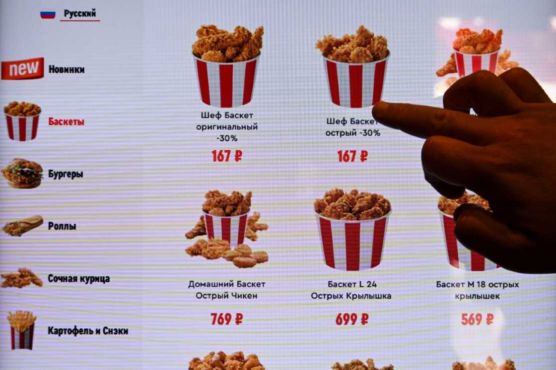 At the Moscow launch, KFC founder Colonel Sanders ws was absent from Rostic's logo, but the new colour scheme still featured the signature red and white At the Moscow launch, KFC founder Colonel Sanders ws was absent from Rostic's logo, but the new colour scheme still featured the signature red and white