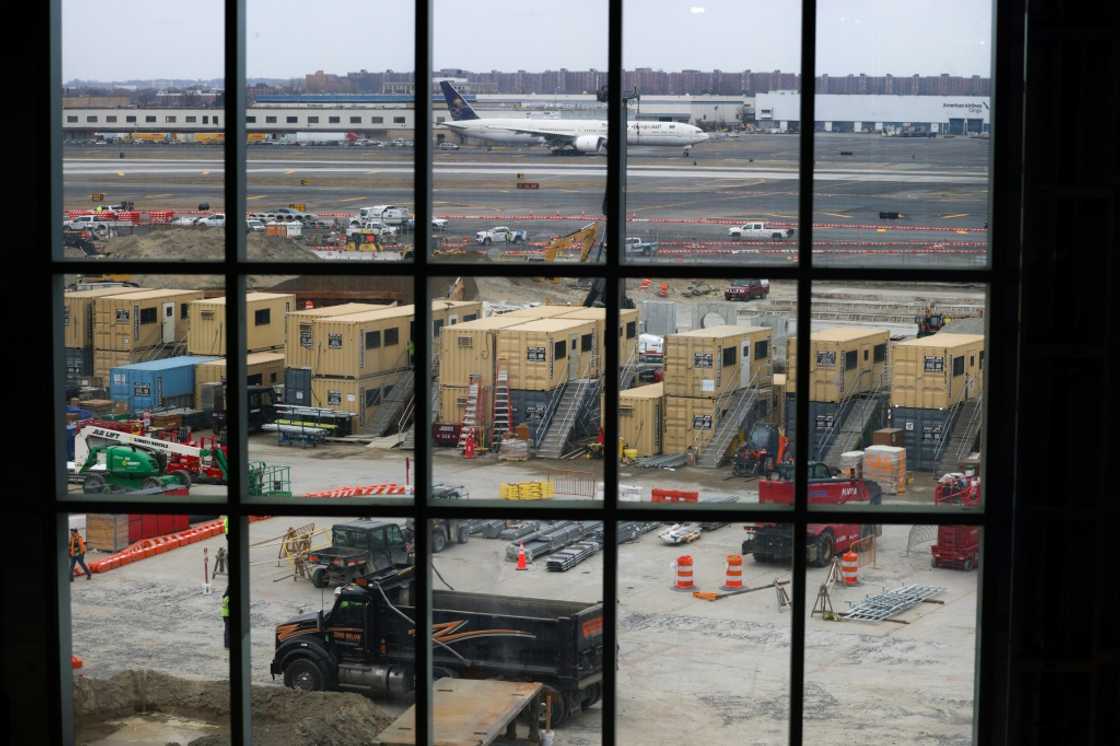 The terminal is strikingly wide and narrow, optimizing the limited space available between runways and the airport's Air Train people mover The terminal is strikingly wide and narrow, optimizing the limited space available between runways and the airport's Air Train people mover