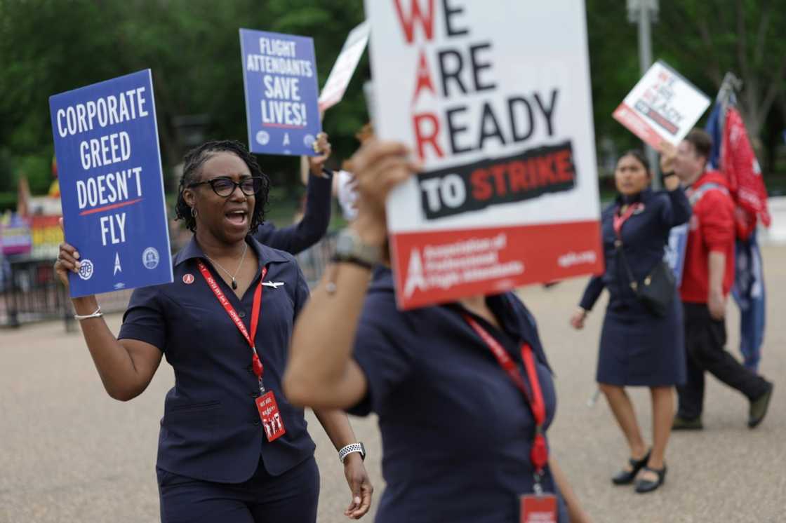 American Airlines flight attendants and their supporters form a picket line outside the White House