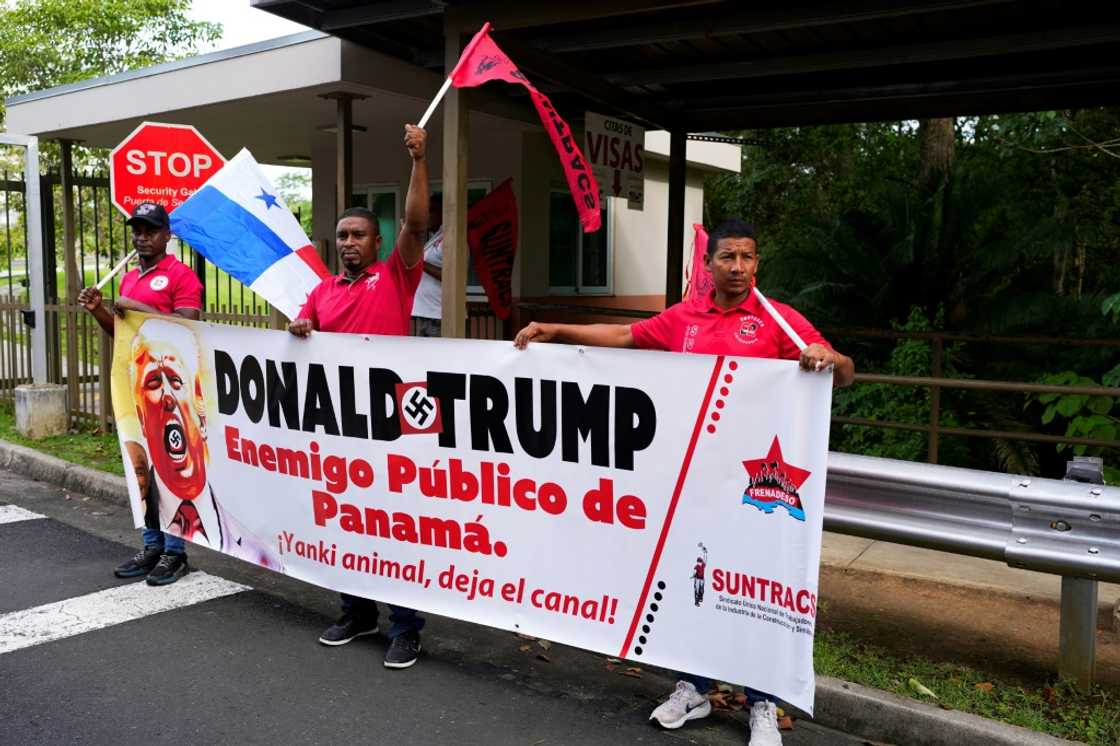 Demonstrators hold a banner that reads 'Donald Trump, public enemy of Panama,' during a protest outside the US embassy on December 24, 2024 Demonstrators hold a banner that reads 'Donald Trump, public enemy of Panama,' during a protest outside the US embassy on December 24, 2024