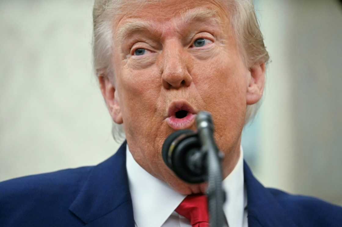 US President Donald Trump says using negotiating tactics to advance the interests of the United States is not the same as "chickening out"