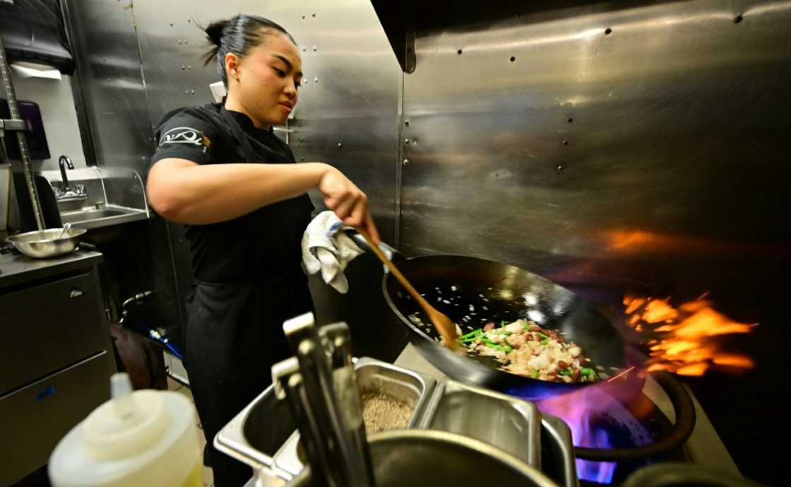 Chef Tue Nguyen cooks her Didi Fried Rice in the kitchen of her first restaurant Di Di in West Hollywood, California Chef Tue Nguyen cooks her Didi Fried Rice in the kitchen of her first restaurant Di Di in West Hollywood, California