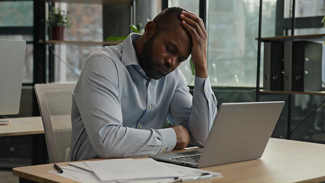 Overworked African American mature ma Overworked African American mature ma