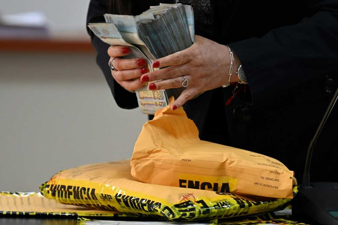 Prosecutors present as evidence the cash they allege Guatemalan journalist Jose Ruben Zamora tried to give to a banker to deposit Prosecutors present as evidence the cash they allege Guatemalan journalist Jose Ruben Zamora tried to give to a banker to deposit