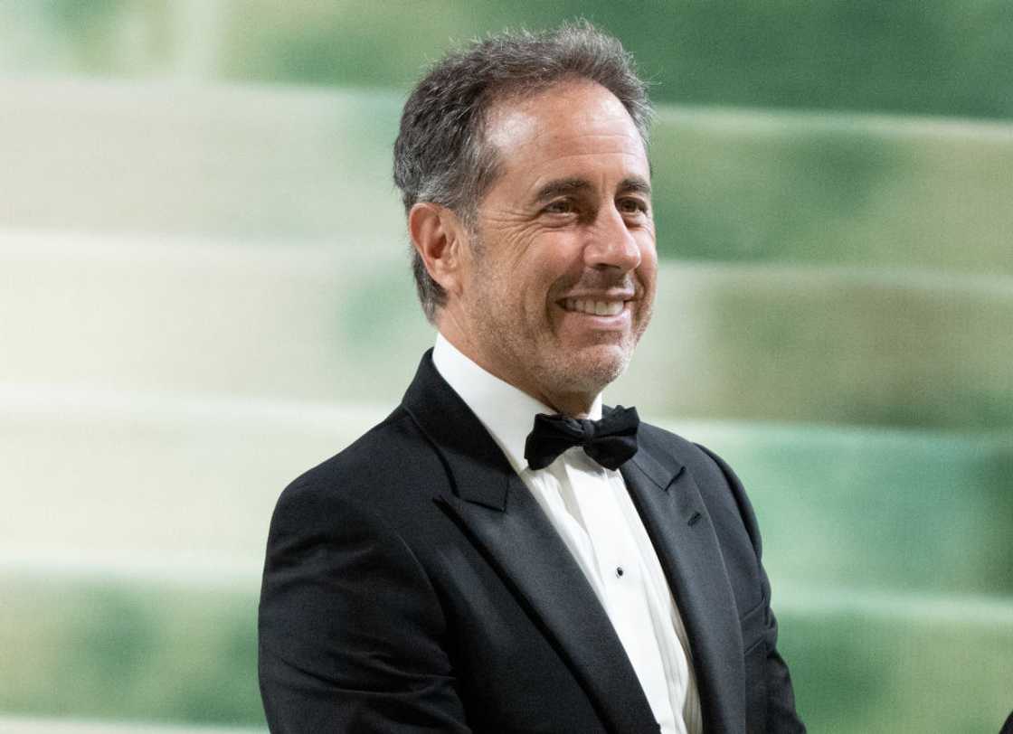 Jerry Seinfeld in a black suit and bow tie