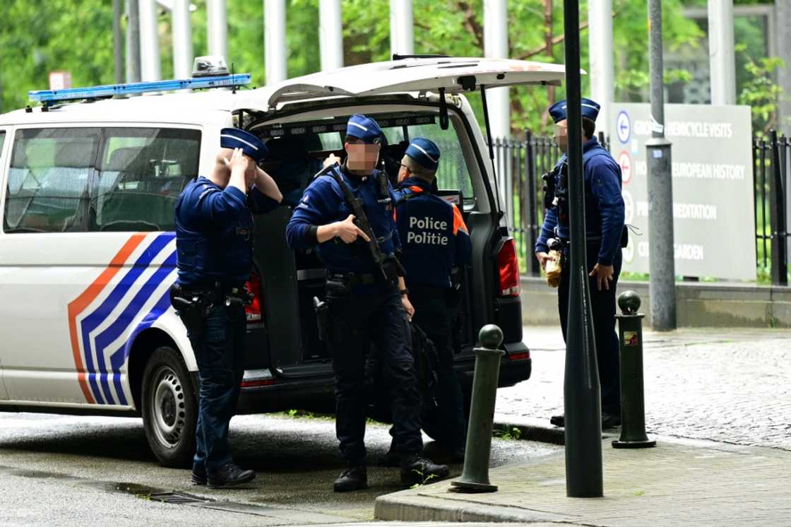 Belgian police stand guard during searches conducted at the European Parliament building as part of a probe into suspected Russian interference Belgian police stand guard during searches conducted at the European Parliament building as part of a probe into suspected Russian interference