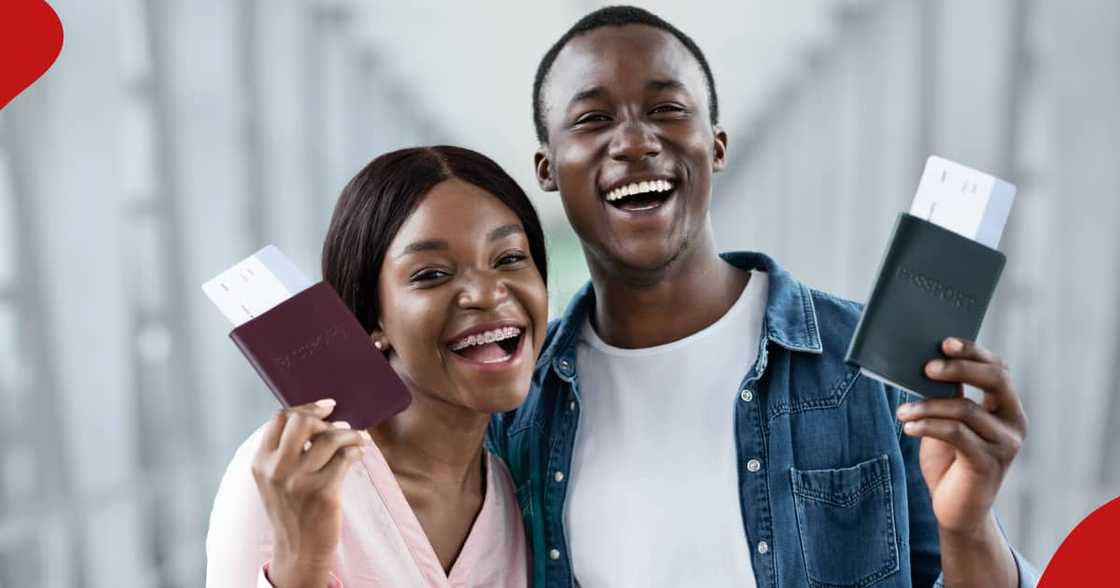 Joyful Emotional African Couple Holding Passports And Tickets - stock photo. Joyful Emotional African Couple Holding Passports And Tickets - stock photo.