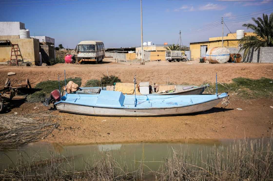 Receding waters: beached boats on a shrinking irrigation canal near Ras al-Bisha in southern Iraq
