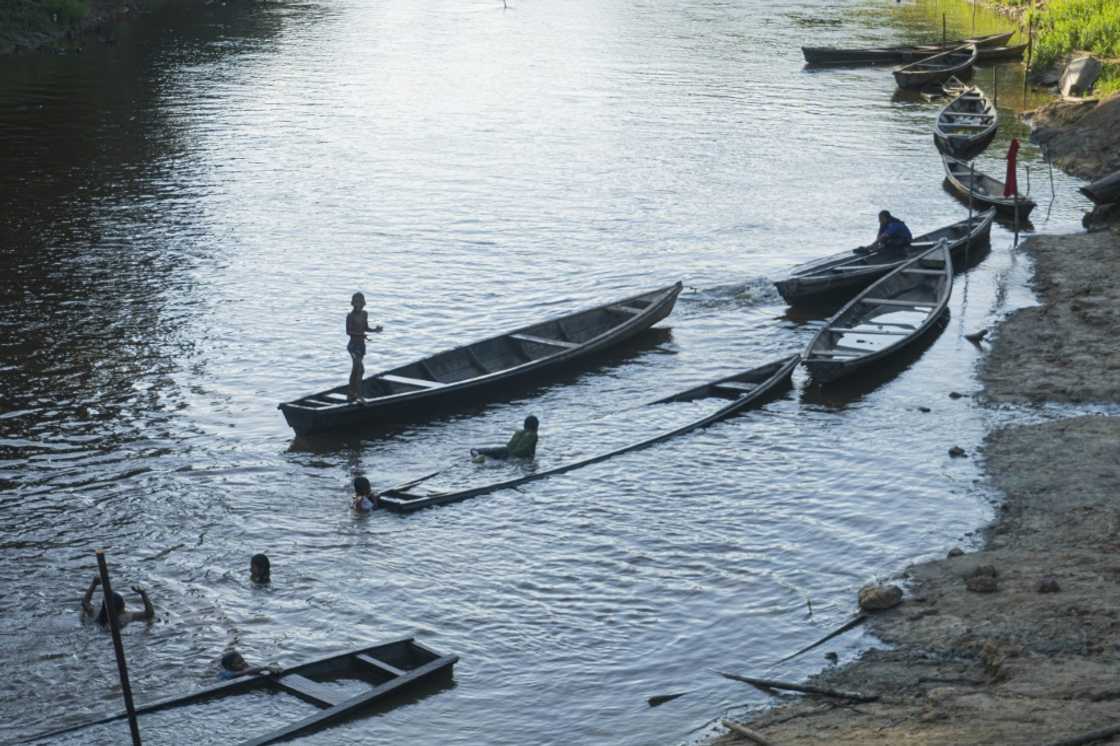 Children play at the Amacayacu river in San Martin de Amacayacu, Colombia, on October 14, 2022