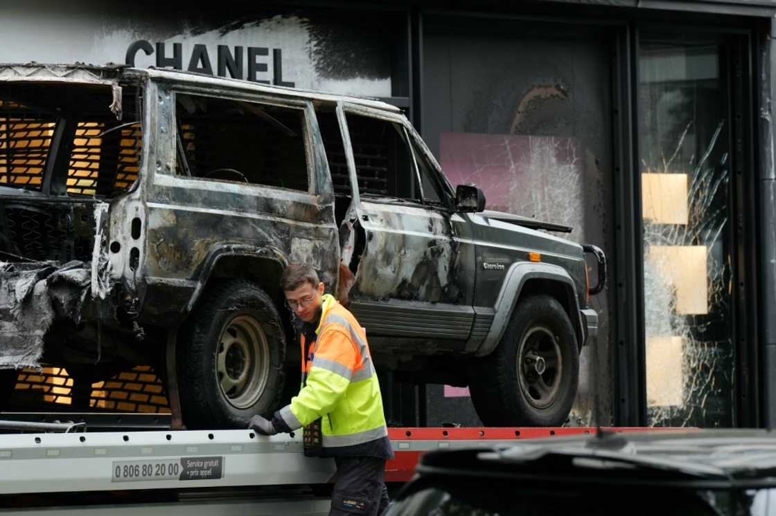 Four people are suspected of taking part in the ram-raid burglary of a Chanel store in Paris. Four people are suspected of taking part in the ram-raid burglary of a Chanel store in Paris.