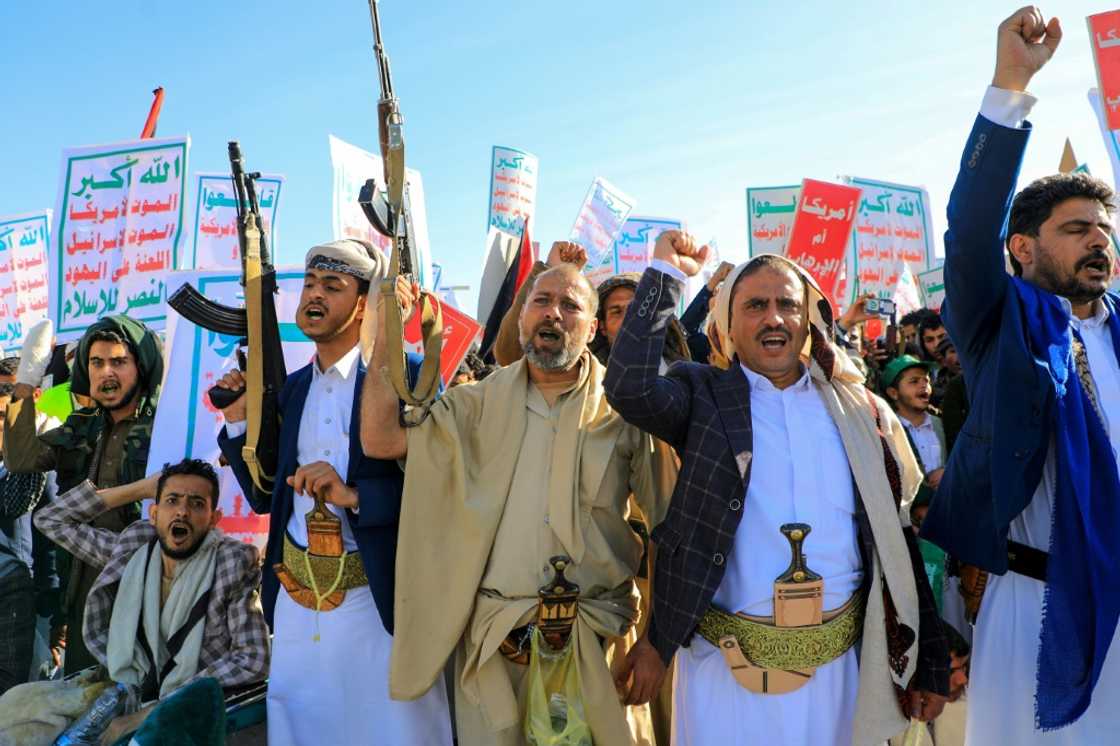 Supporters of Yemen's Huthis brandish rifles during an anti-Israel and anti-US rally Supporters of Yemen's Huthis brandish rifles during an anti-Israel and anti-US rally