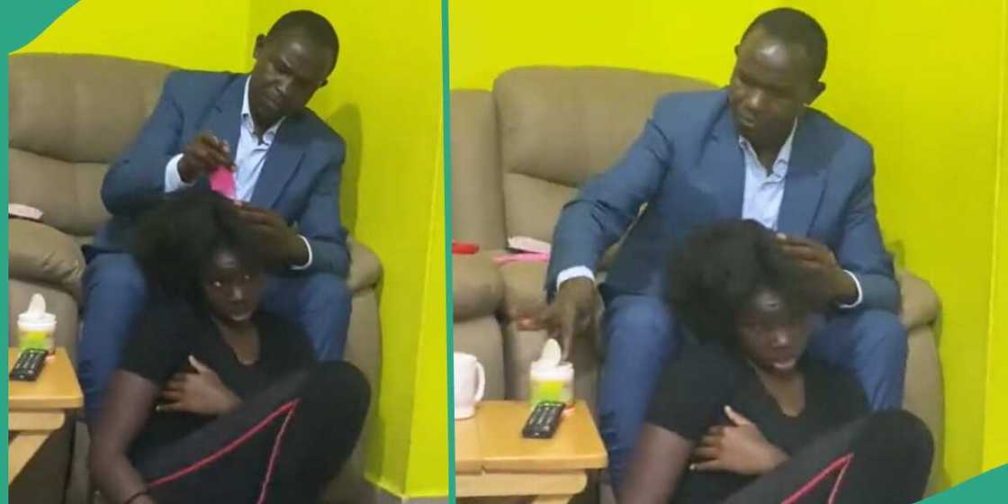 Man makes his daughter's hair. Man makes his daughter's hair.