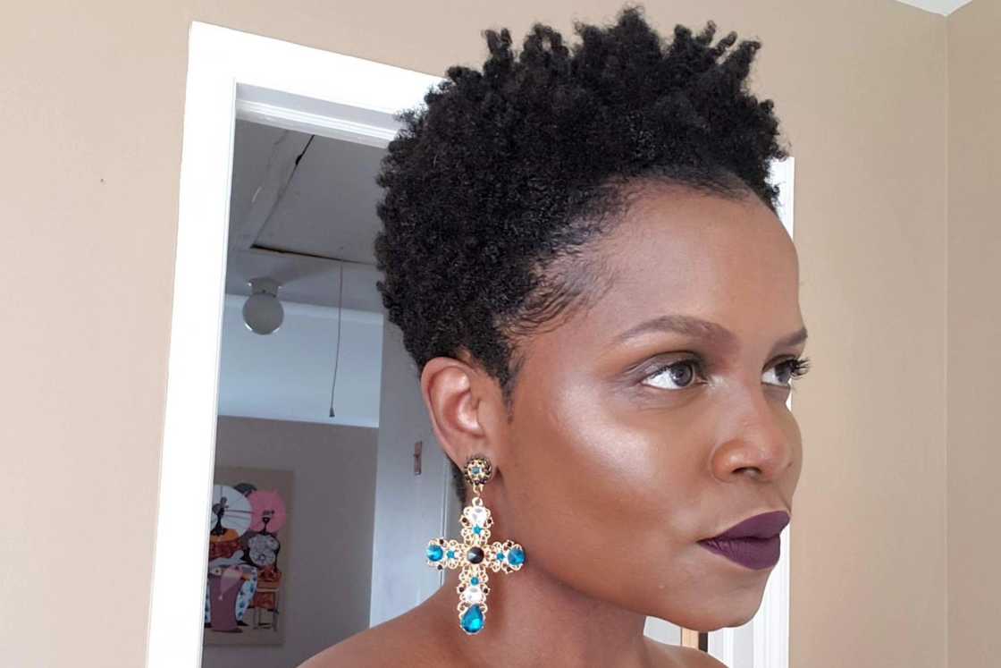 An African lady with coily hair An African lady with coily hair