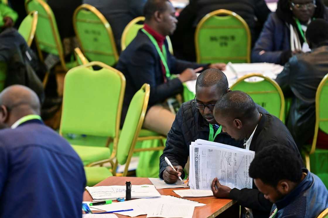 The election commission is under heavy pressure to deliver a clean poll and release results by Tuesday The election commission is under heavy pressure to deliver a clean poll and release results by Tuesday