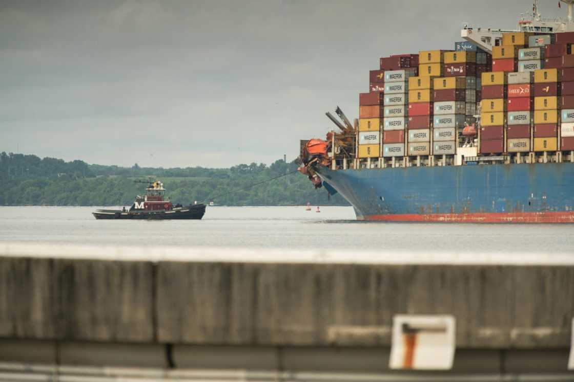 Tugboats guide the container ship Dali after it was refloated in Baltimore, Maryland