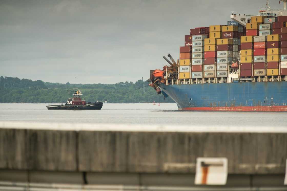 Tugboats guide the container ship Dali after it was refloated in Baltimore, Maryland Tugboats guide the container ship Dali after it was refloated in Baltimore, Maryland