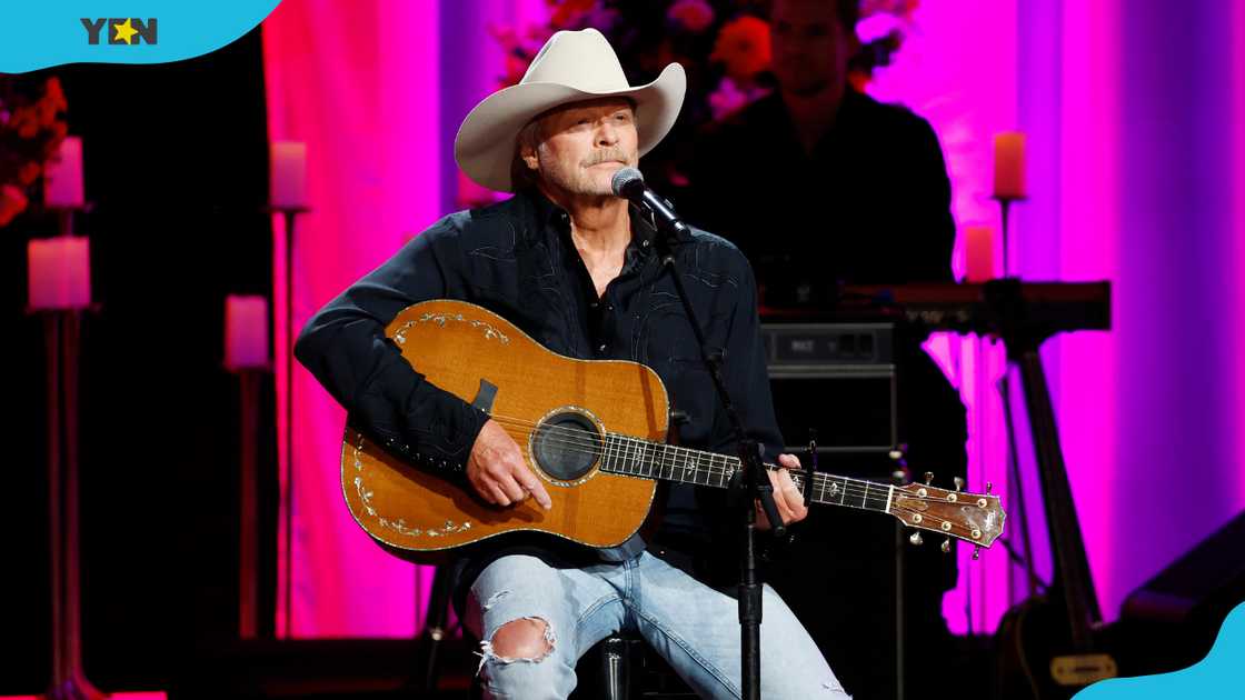 Alan Jackson performs onstage at The Grand Ole Opry in Nashville, Tennessee.