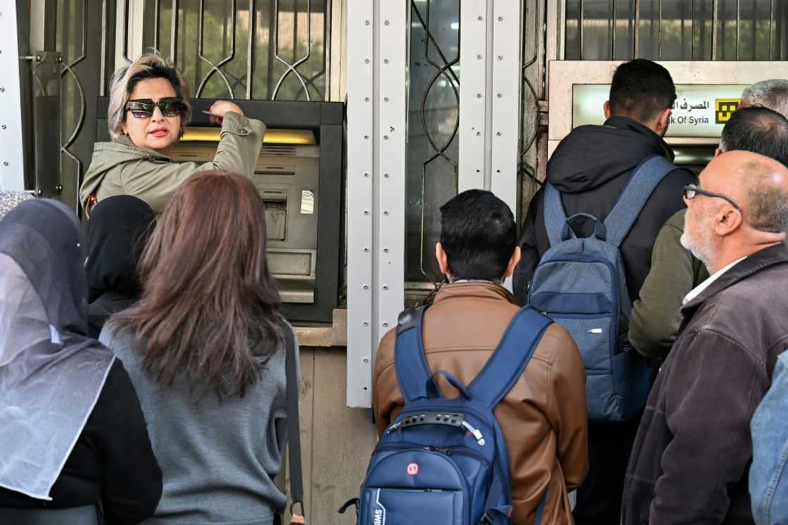 A liquidity crisis has forced Syrian authorities to drastically limit cash withdrawals, leaving much of the population struggling to make ends meet A liquidity crisis has forced Syrian authorities to drastically limit cash withdrawals, leaving much of the population struggling to make ends meet