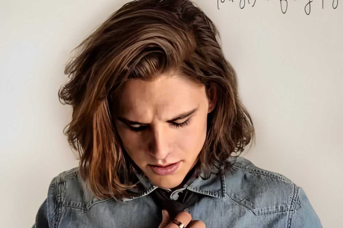 A man shows off his blurred side part style A man shows off his blurred side part style