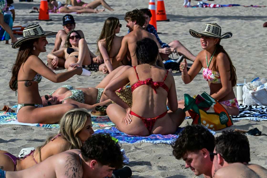 Revelers enjoy the beach on Las Olas Boulevard, Fort Lauderdale, Florida, during spring break weekend. Fewer Canadians are vacationing in the US Revelers enjoy the beach on Las Olas Boulevard, Fort Lauderdale, Florida, during spring break weekend. Fewer Canadians are vacationing in the US