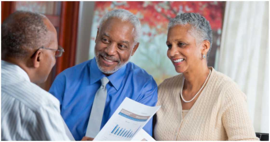 A couple talking to a financial advisor about financing their home