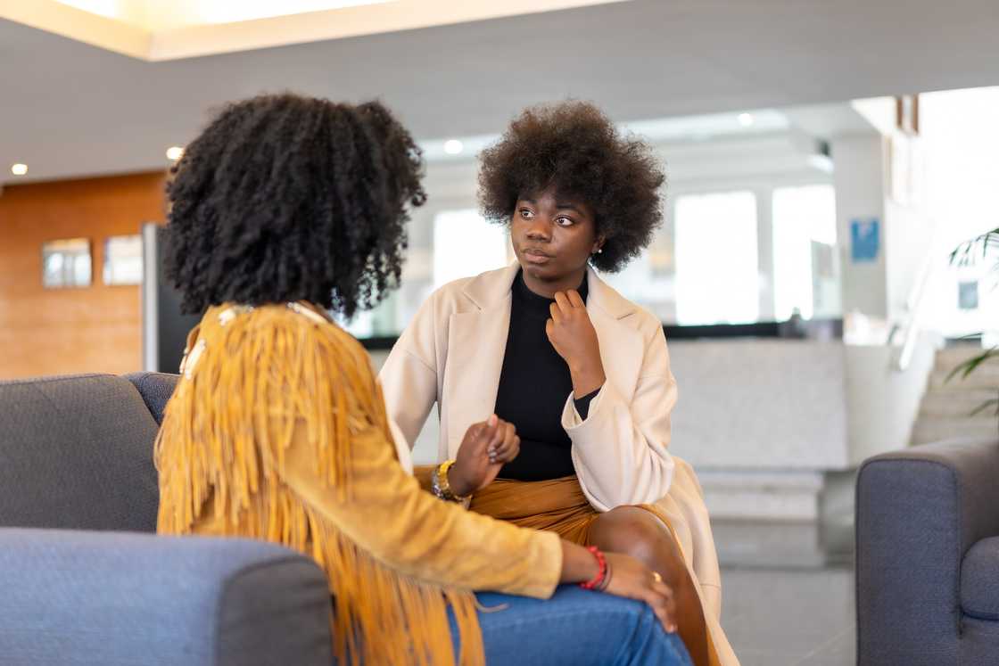 A woman expressing her concerns to another woman