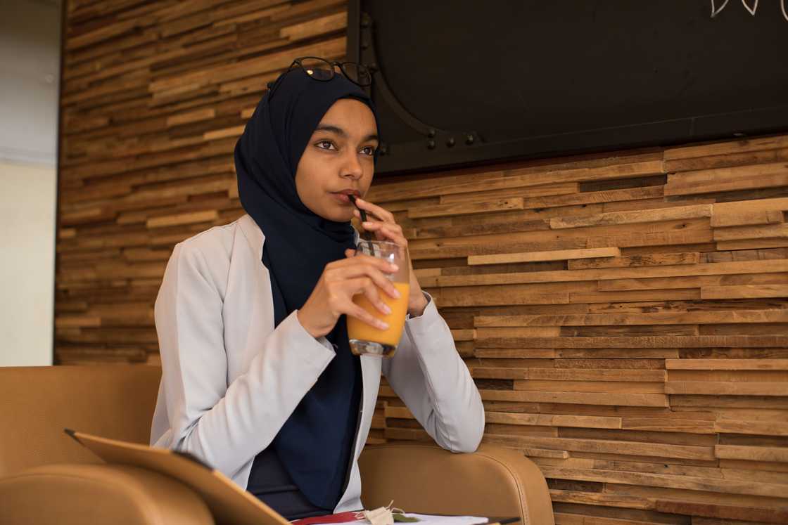 Woman in a hijab is thinking