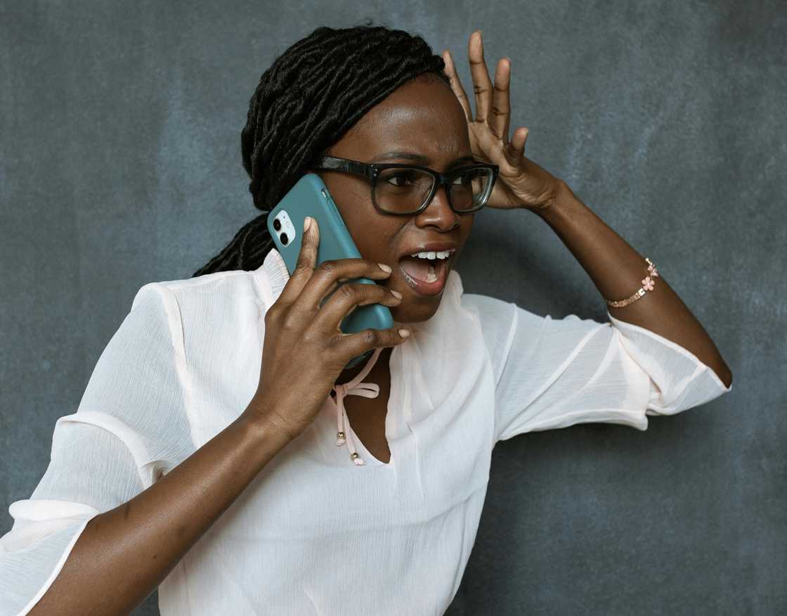 A woman distressed while on a phone call