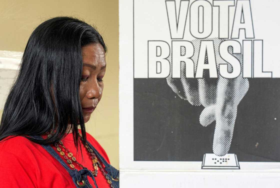 A Ticuna woman casts her ballot