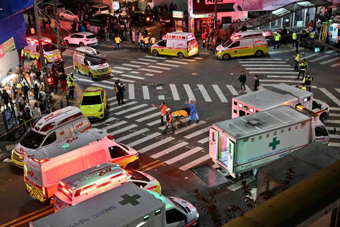 Authorities cordoned off a street where some 120 people were killed in a stampede in South Korea's capital Seoul Authorities cordoned off a street where some 120 people were killed in a stampede in South Korea's capital Seoul