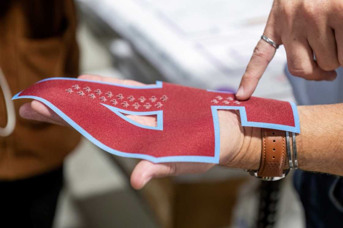 A laser-cut number is inspected at SP Apparel in Saint-Hyacinthe, Quebec, Canada, on September 27, 2024