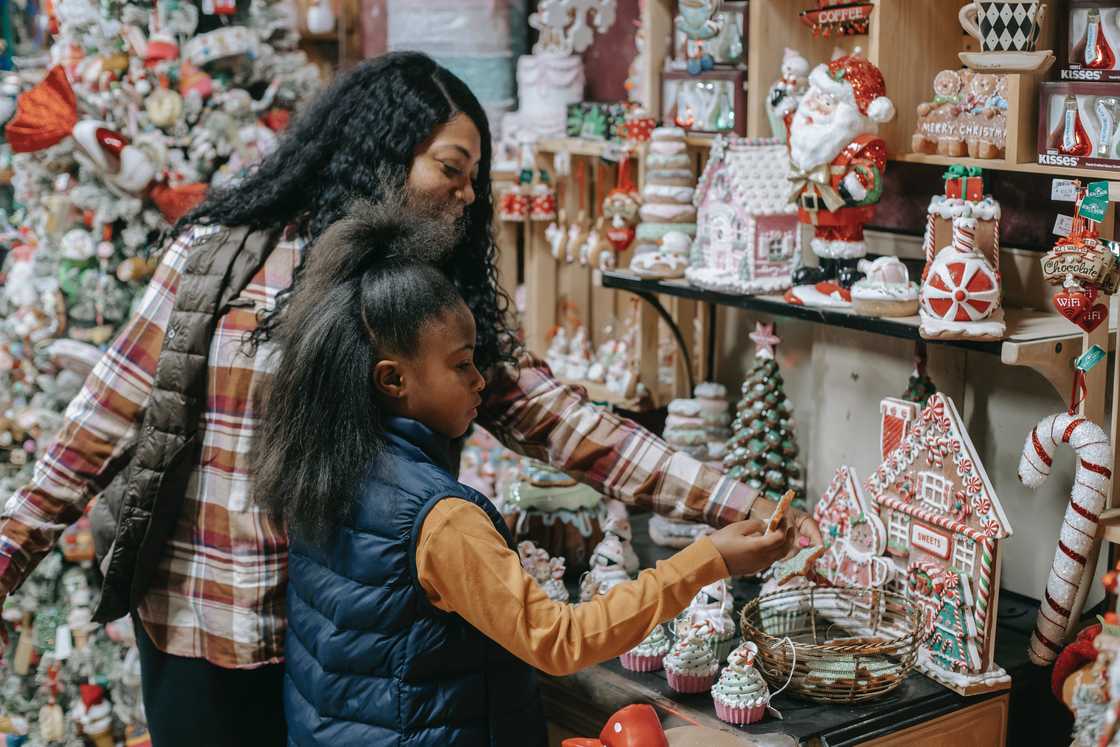 A mum and her daughter in a gift shop