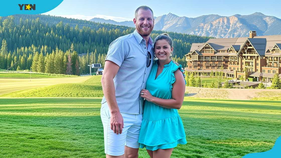 Carson Wentz and Madison Oberg pose together on a scenic resort lawn. Carson Wentz and Madison Oberg pose together on a scenic resort lawn.