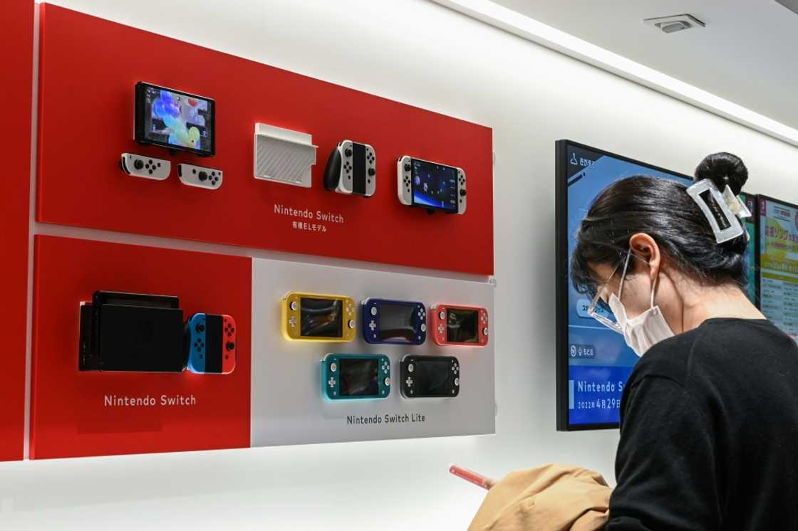 Japanese gaming giant Nintendo raised its annual forecasts on Tuesday after strong first-half sales of its new "Zelda" and "Mario" franchise games