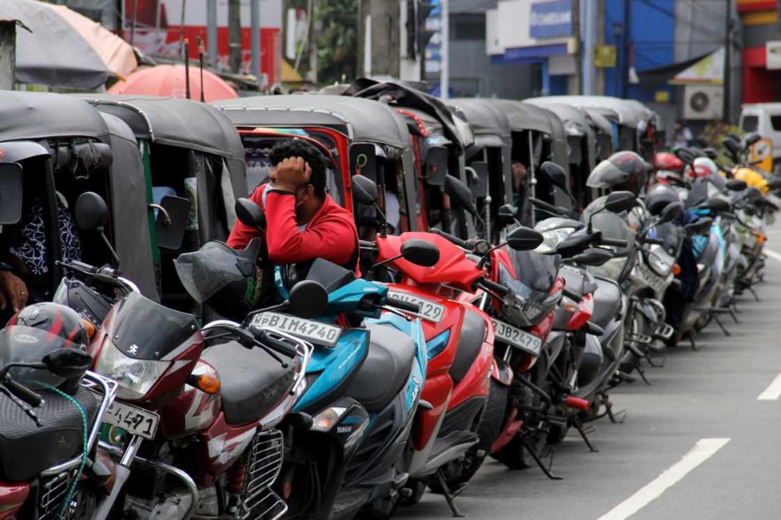 Motorists queue to buy fuel at a Ceylon petroleum corporation fuel station in Colombo Motorists queue to buy fuel at a Ceylon petroleum corporation fuel station in Colombo