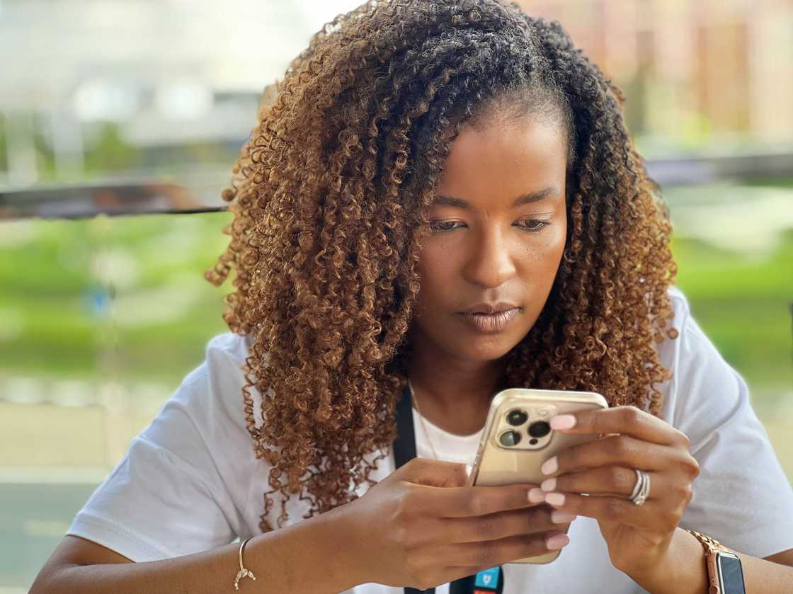 A woman checking her smartphone A woman checking her smartphone