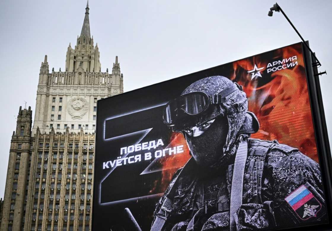 Russia's foreign ministry behind a billboard showing the letter 'Z' -- a tactical insignia of Russian troops in Ukraine -- with the caption 'Victory is forged in fire' Russia's foreign ministry behind a billboard showing the letter 'Z' -- a tactical insignia of Russian troops in Ukraine -- with the caption 'Victory is forged in fire'