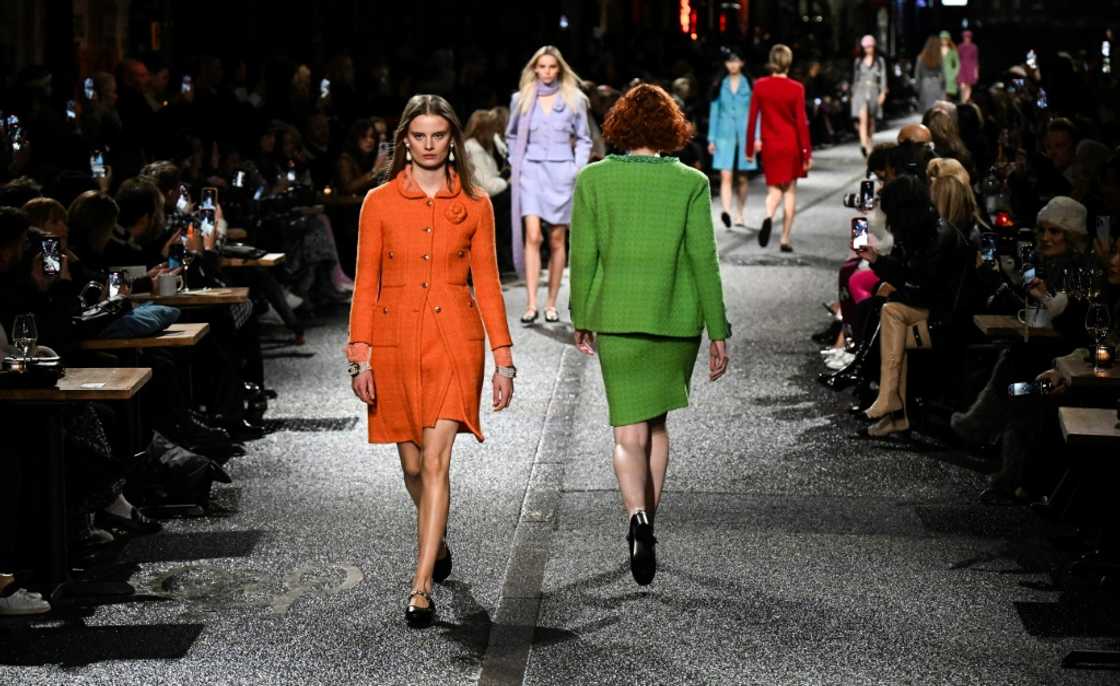 Models strutted down the catwalk sporting dazzling clothing Models strutted down the catwalk sporting dazzling clothing