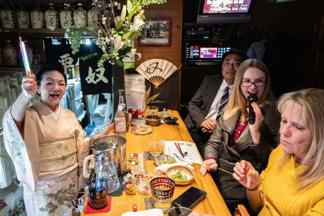 Japan's snack bars are cosy, retro establishments often crammed into small buildings and equipped with karaoke systems that echo late into the night