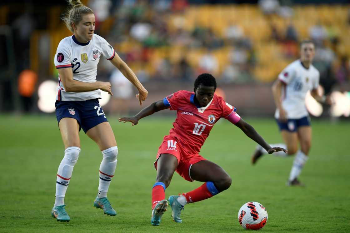 The United States' Kristie Mewis (L) vies for the ball with Haiti's Nerilia Mondesir during the CONCACAF W tournament in Monterrey, Mexico The United States' Kristie Mewis (L) vies for the ball with Haiti's Nerilia Mondesir during the CONCACAF W tournament in Monterrey, Mexico