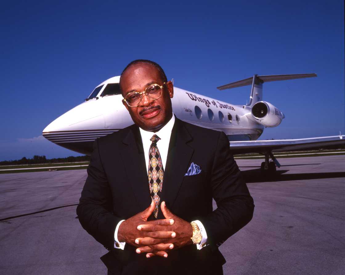 Willie E. Gary standing in front of his private jet 'Wings of Justice