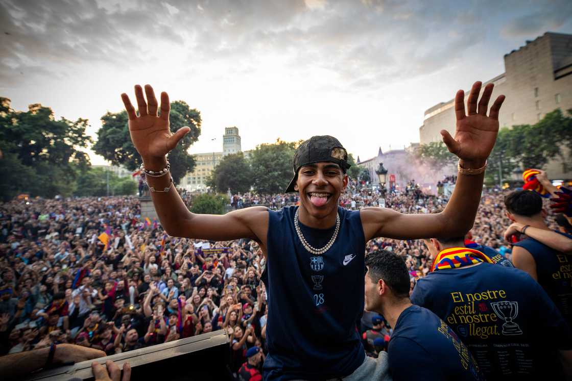 Lamine Yamal looking cheerful at Barcelona La Liga open bus trophy parade on May 16, 2025